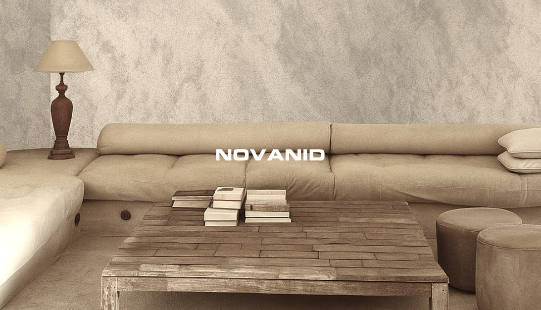 Baño moderno con luz natural, lavabo minimalista y espejo redondo y placas decorativas novanid. Logo "NOVANID" visible.